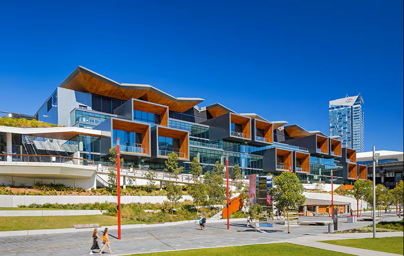 ICC Sydney exterior at dusk with illuminated colorful facade